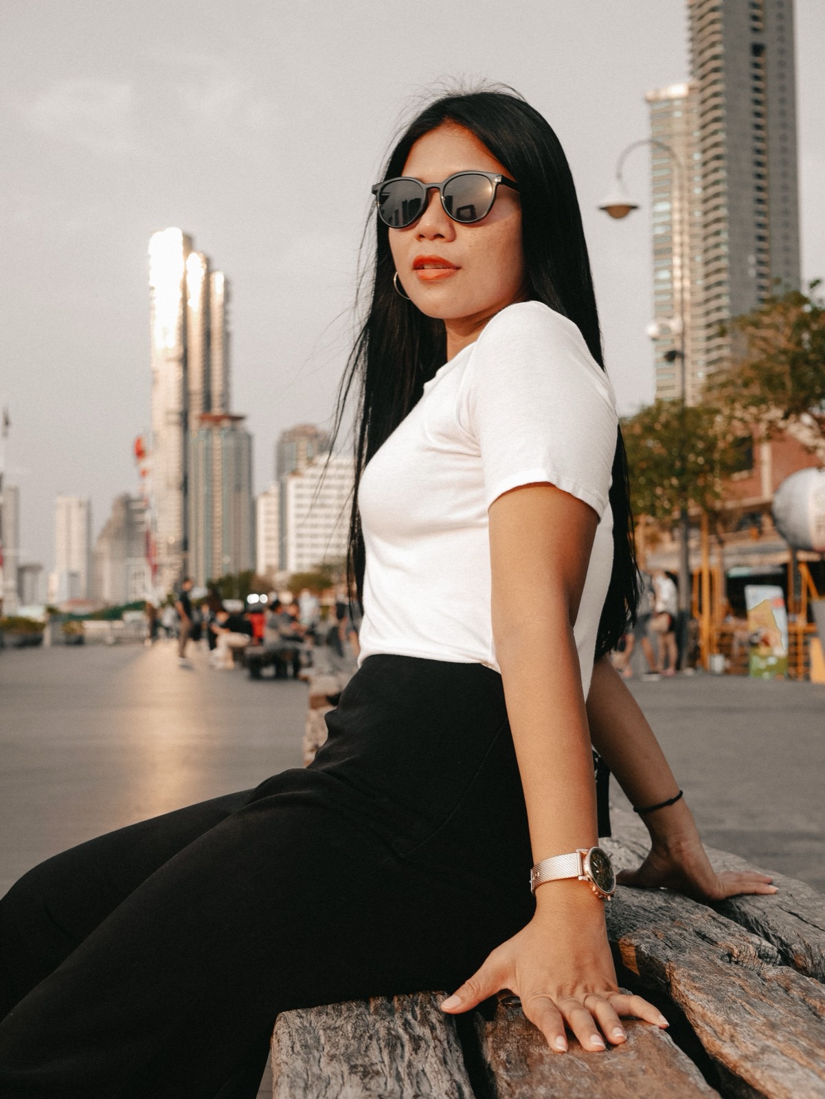 Thai woman with Bangkok skyline behind her
