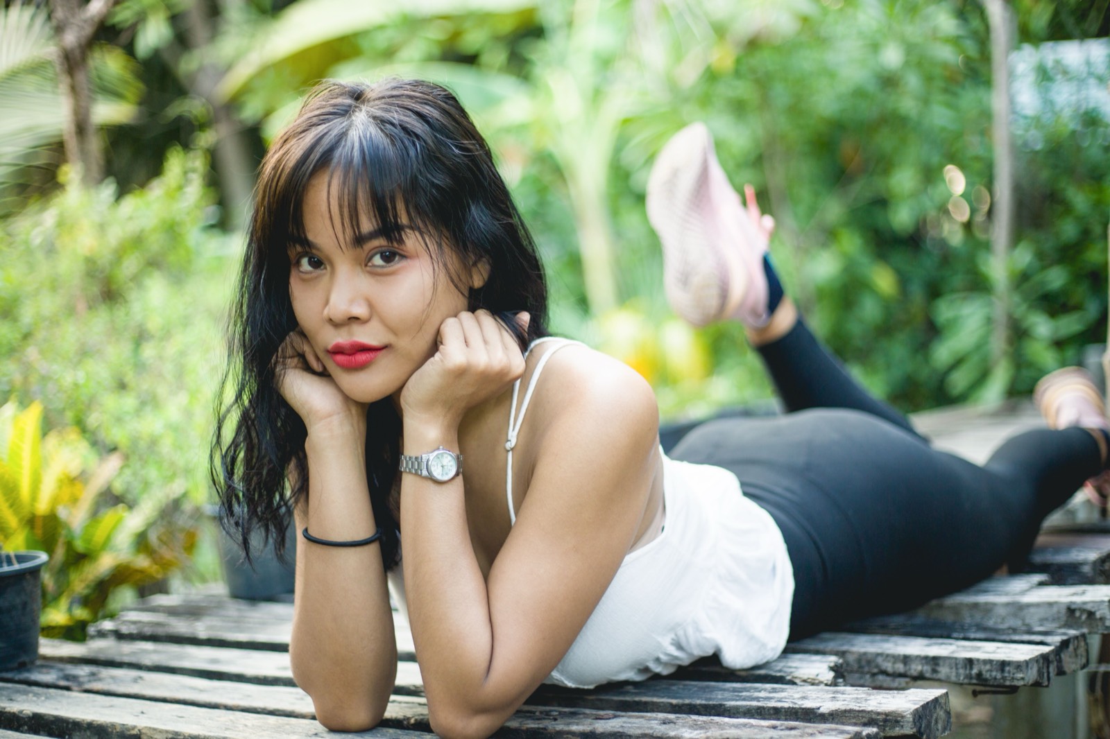 Thai woman on a garden deck